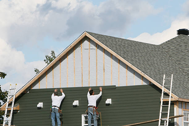 Professional Siding Installation technician working in Sea Cliff, NY